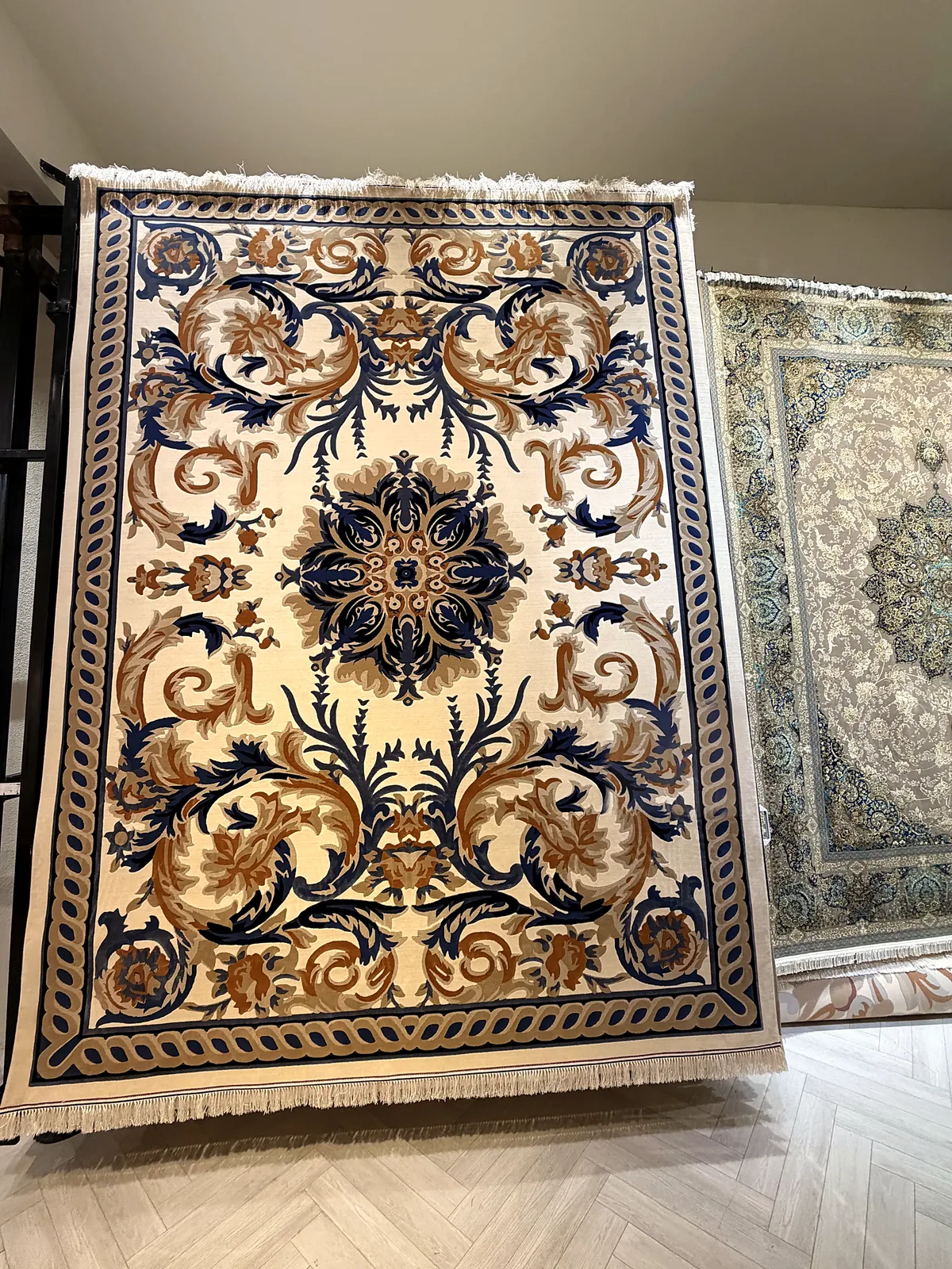 Ivory and navy carpet on display