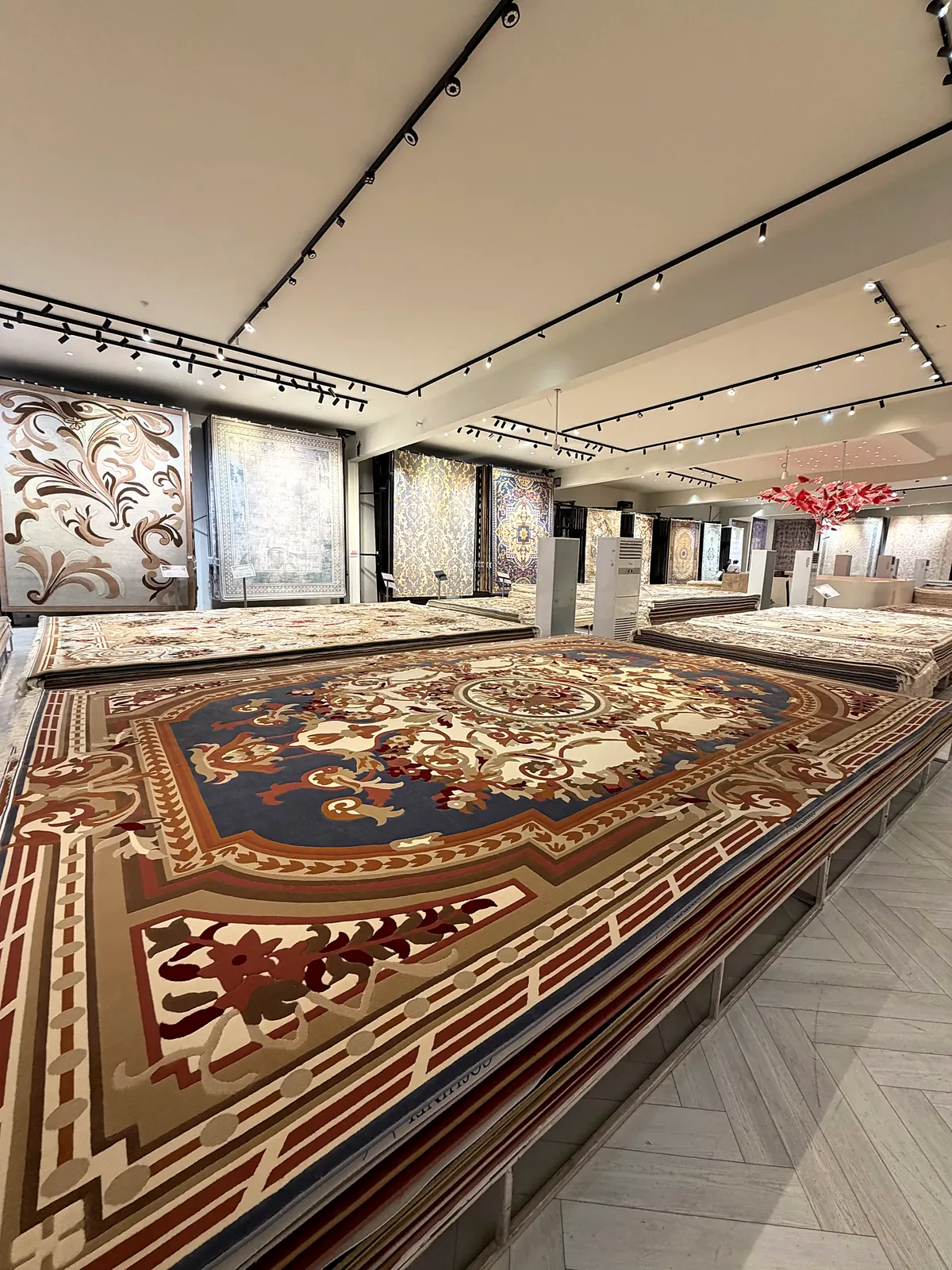 Carpets laid out across the showroom floor